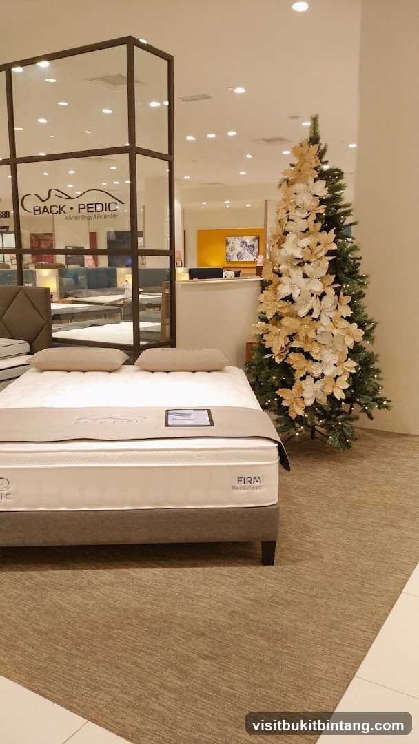Mattress store display with Christmas tree
