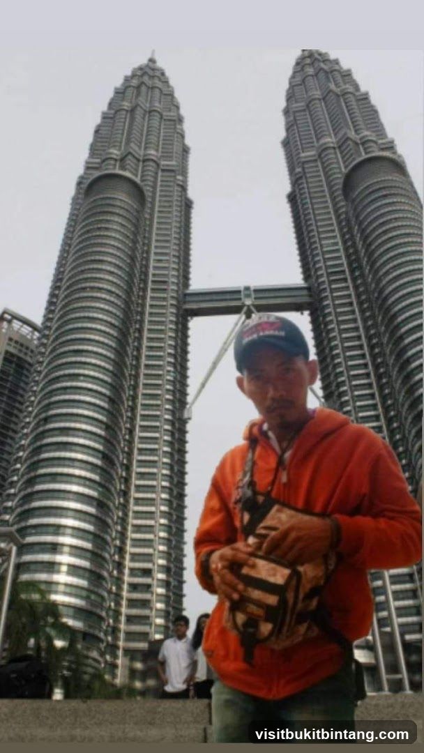 Man in front of Petronas Towers