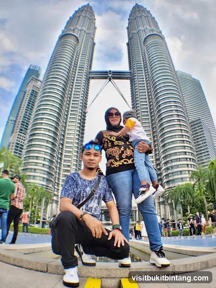 Family posing in front of Petronas Towers