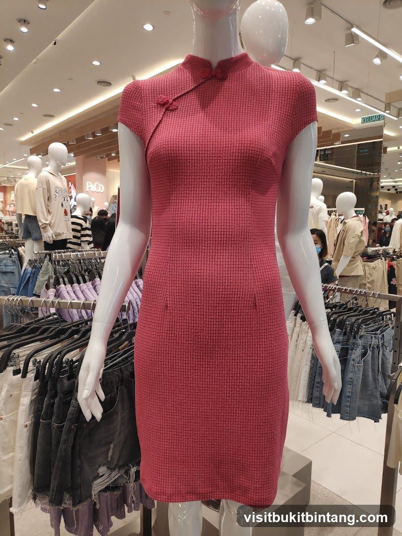 Mannequin wearing a pink dress