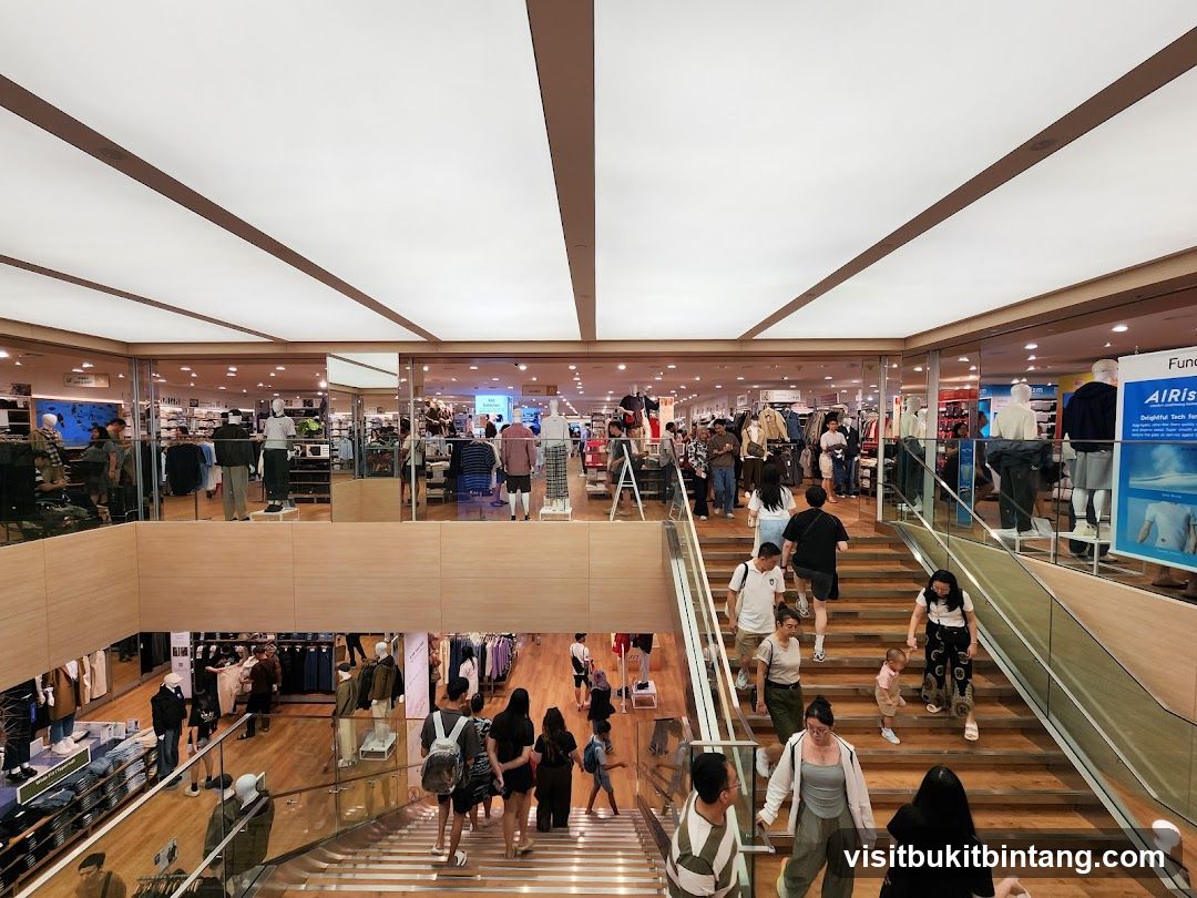 Busy clothing store interior with shoppers
