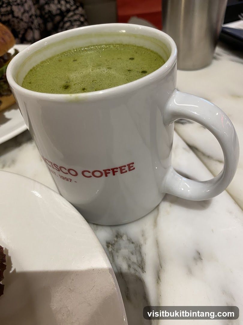 Matcha Latte in a Branded Mug