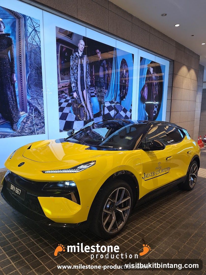 Yellow car with Jaeger-LeCoultre branding