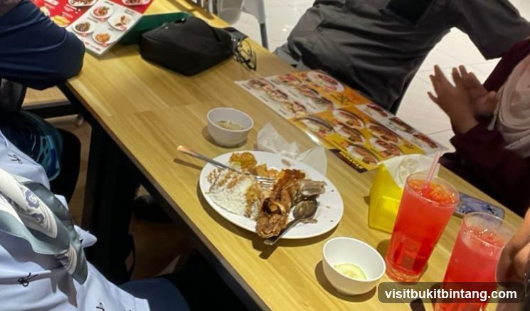 Diners at a table with food and drinks