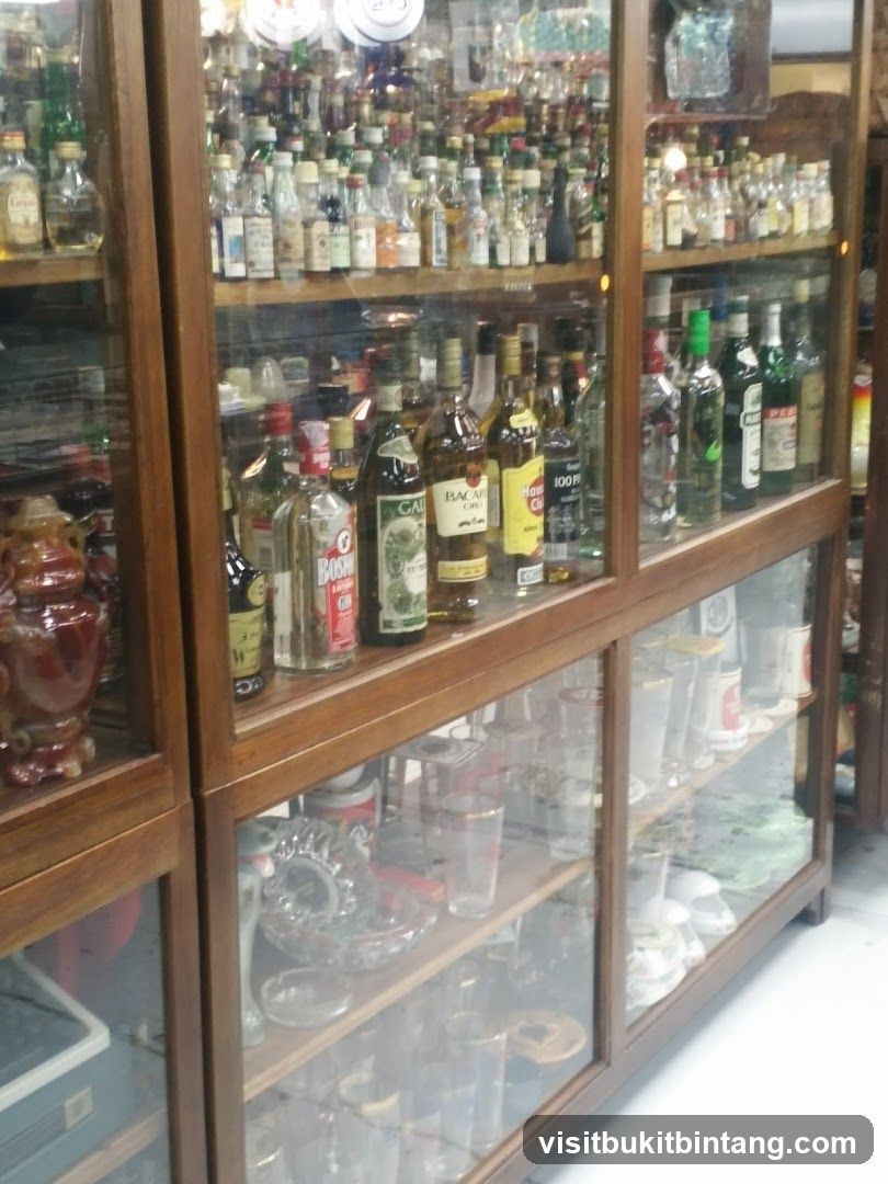 Display cabinet with bottles and glassware