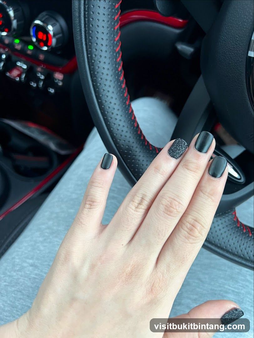 Matte Black Nails with Glitter Accent