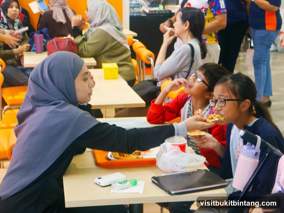 People eating pizza at a food court