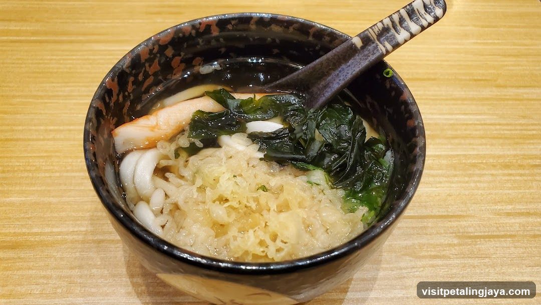 Bowl of Japanese-style noodle soup with seafood and seaweed