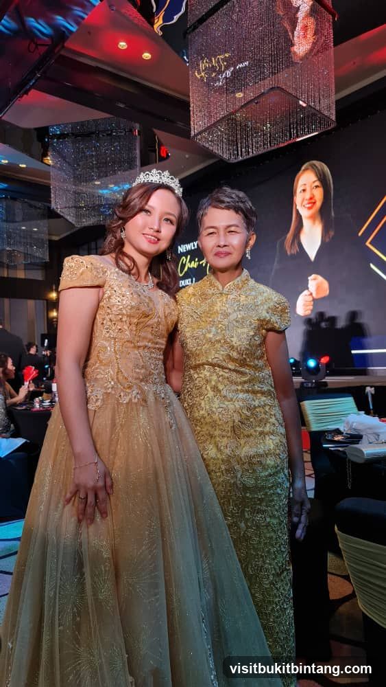 Two women in formal attire at an event