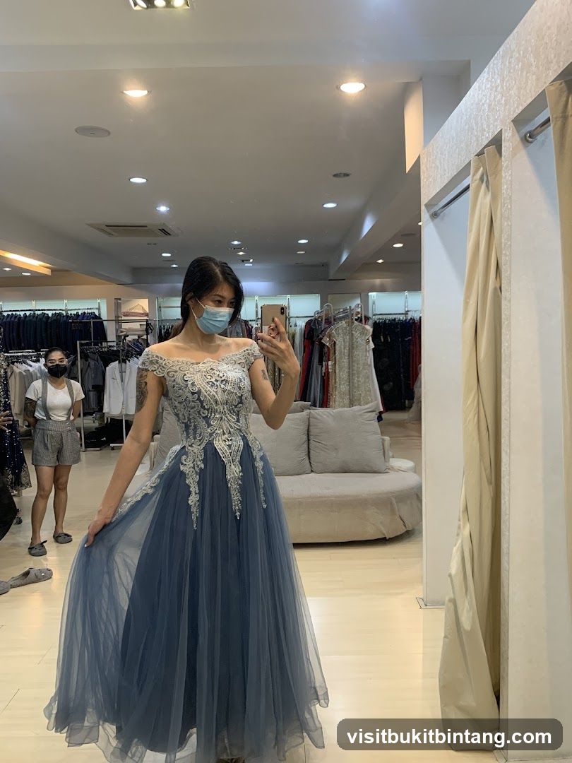 Woman trying on a blue gown