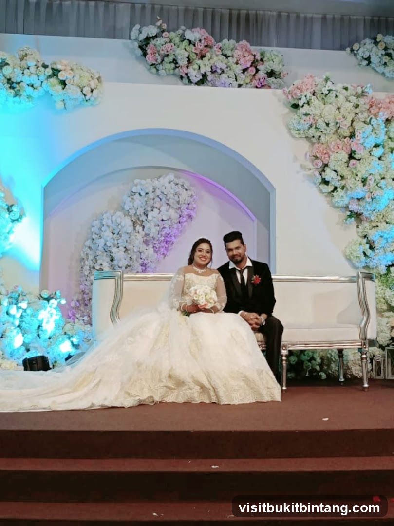 Wedding Couple Posed on a White Sofa