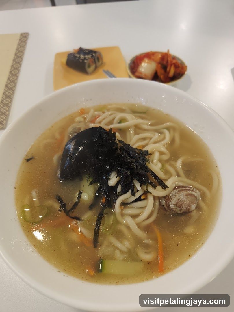 Bowl of Noodle Soup with Side Dishes