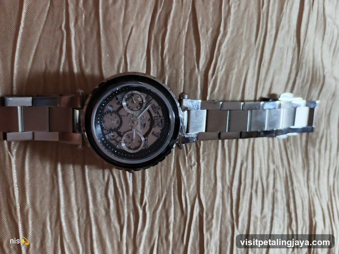 Metal Watch on Fabric Background