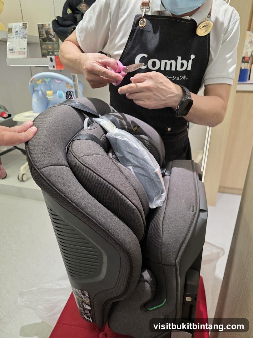 Employee opening packaging for a car seat