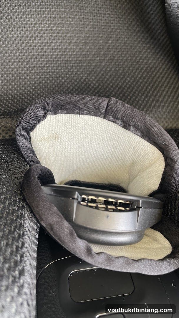 Close-up of a car seat buckle mechanism