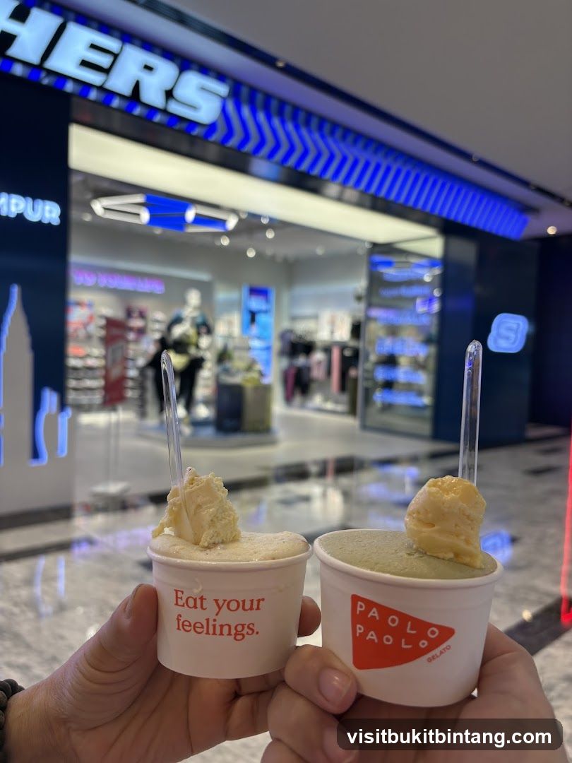 Two cups of gelato in front of a Skechers store