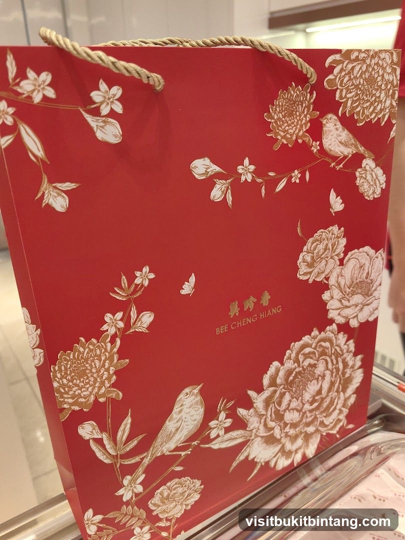 Red Gift Bag with Floral and Bird Design