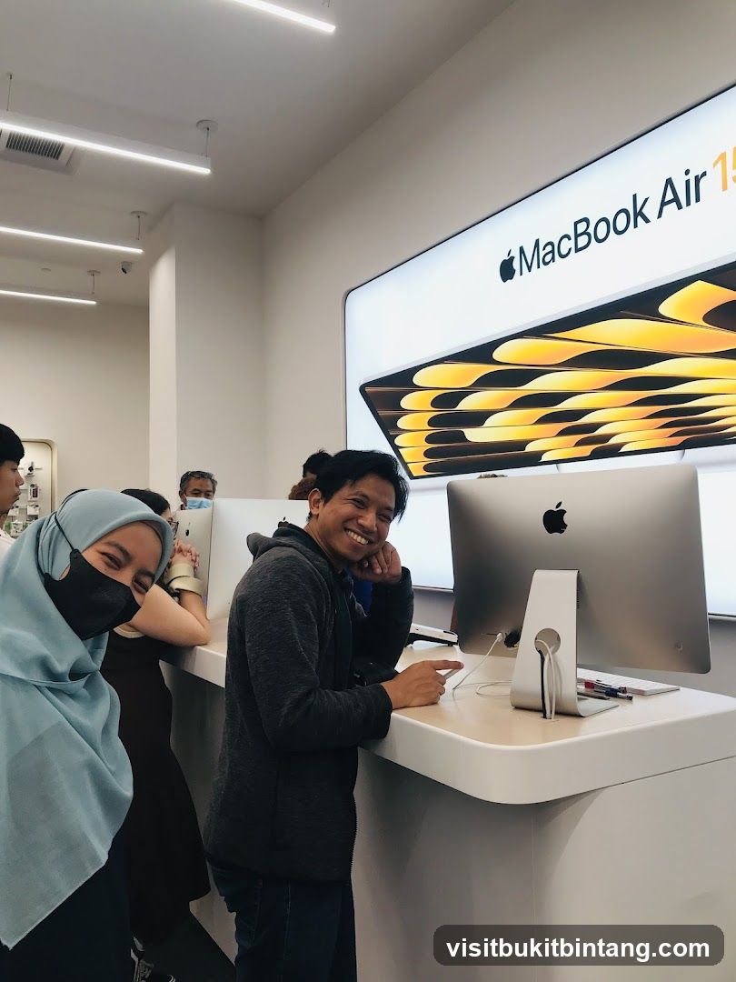 People looking at Apple products