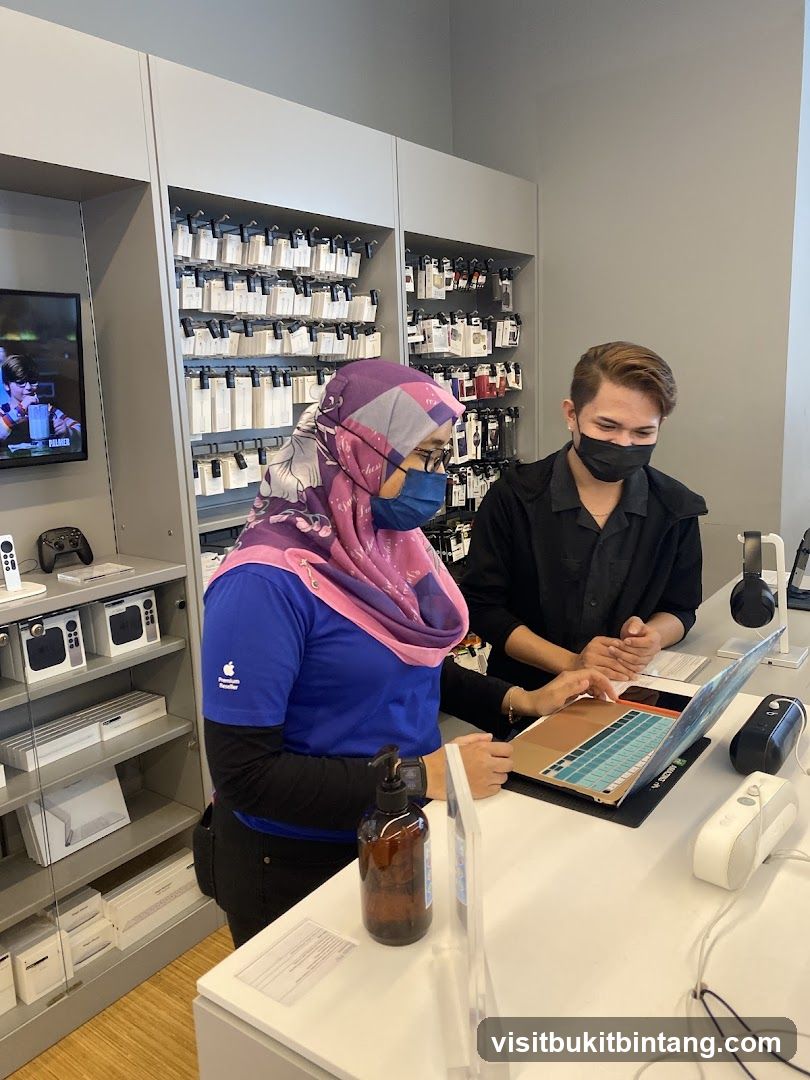 Apple Store Employees Assisting Customer