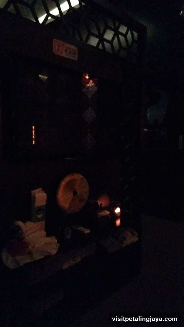 Dimly lit interior with shrine-like setup
