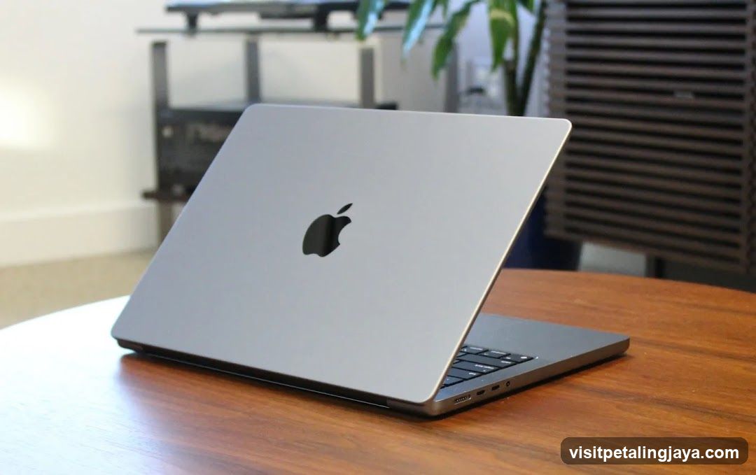 Apple Laptop on Wooden Table