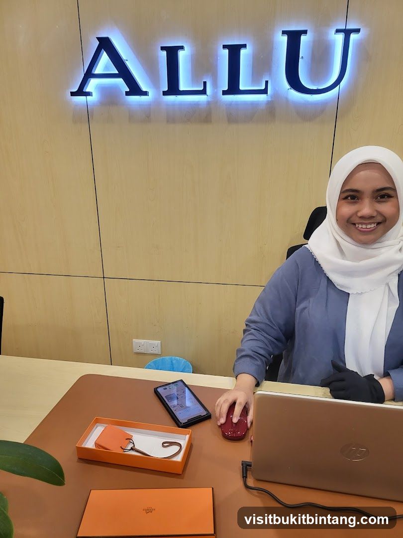 Woman at Desk with Laptop and Hermes Item
