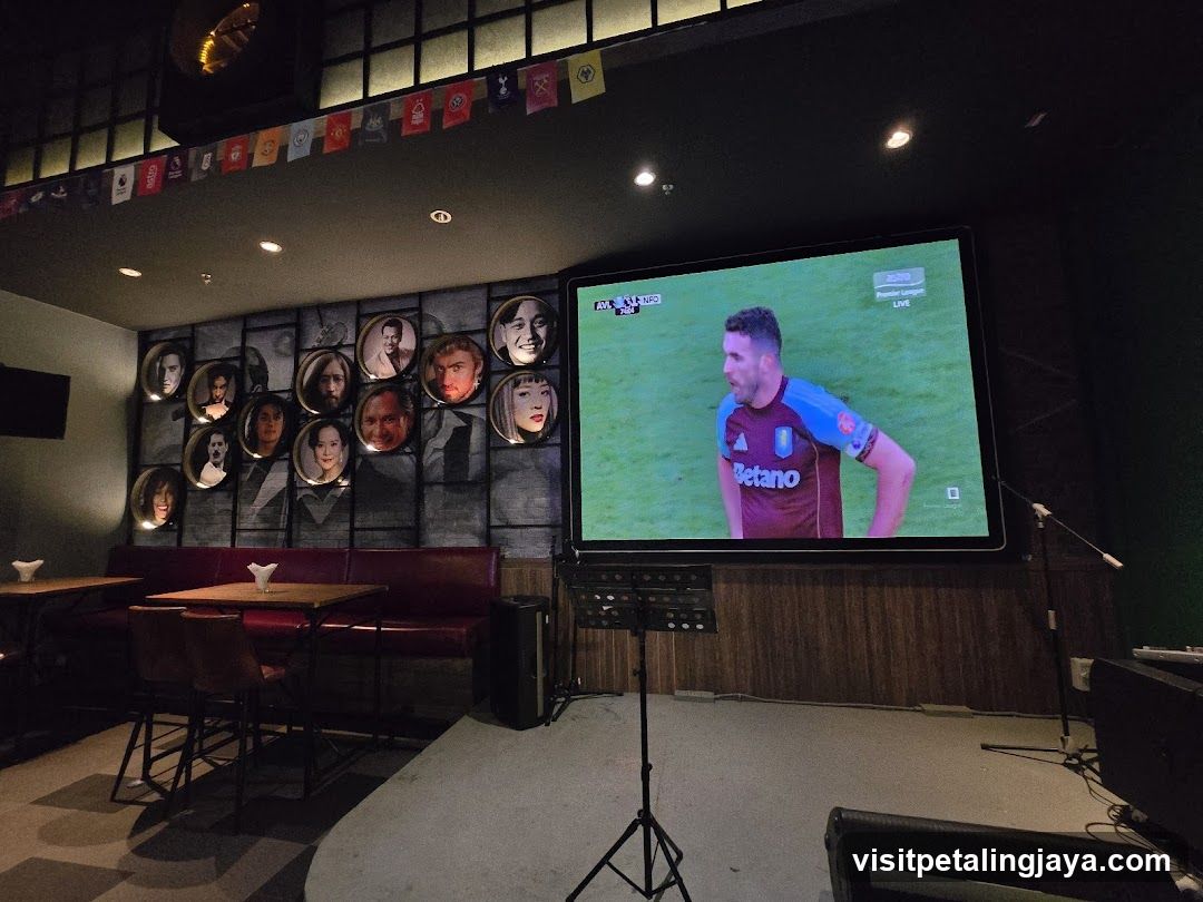 Karaoke Room Interior with TV and Decorative Wall