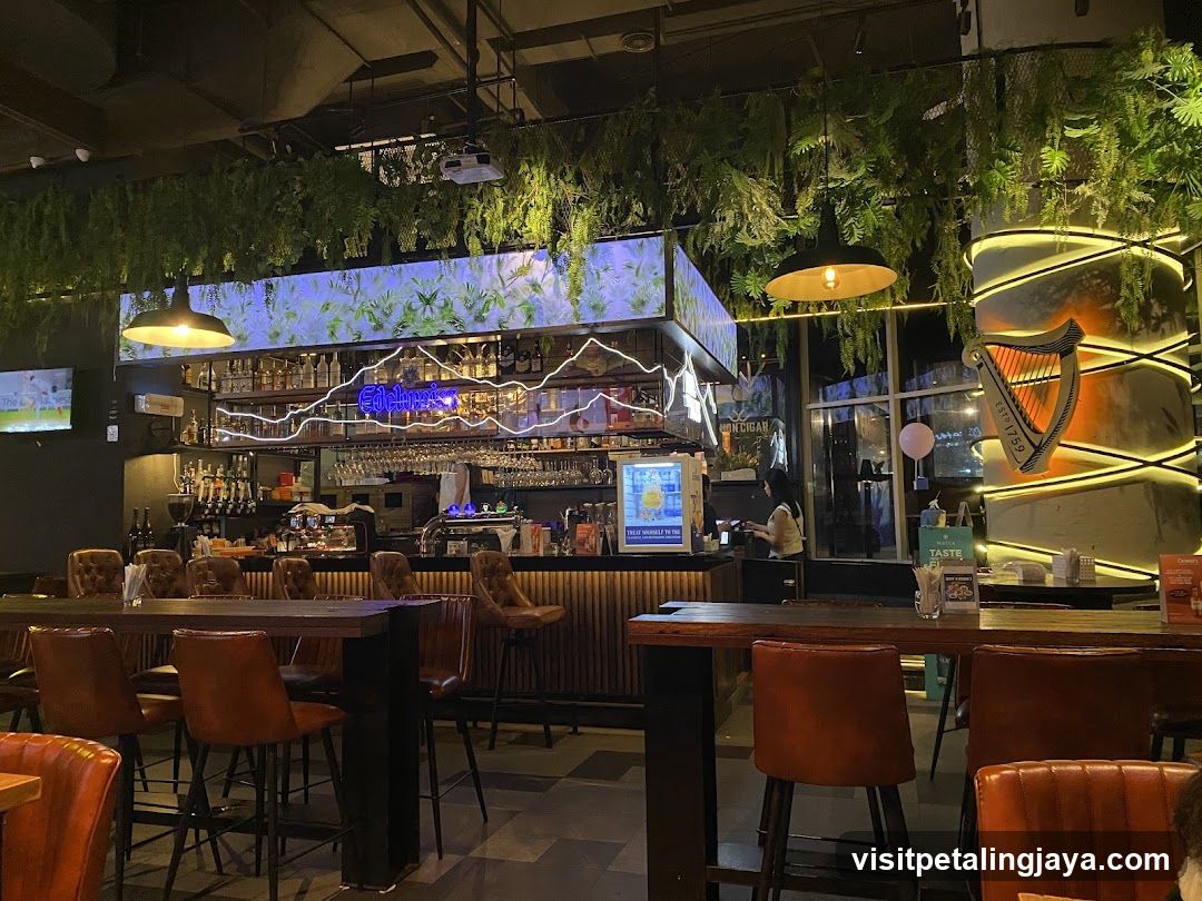 Bar Interior with Greenery and Harp Signage