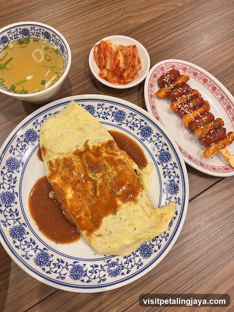 Japanese-style meal with omurice and side dishes
