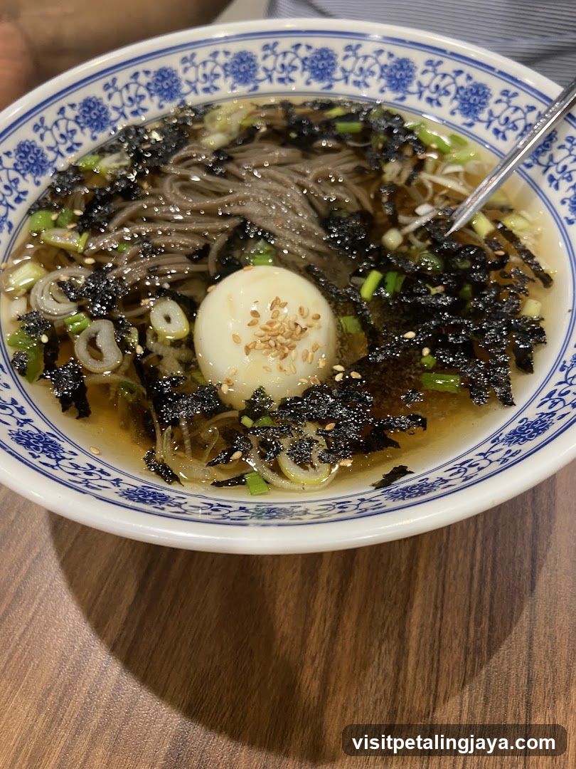 Bowl of Soba Noodles with Soft-Boiled Egg and Toppings