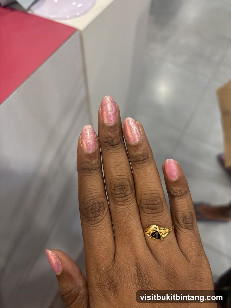 Woman's Hand with Pink Nail Polish