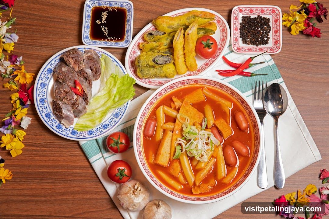 Korean-style meal spread with side dishes and condiments