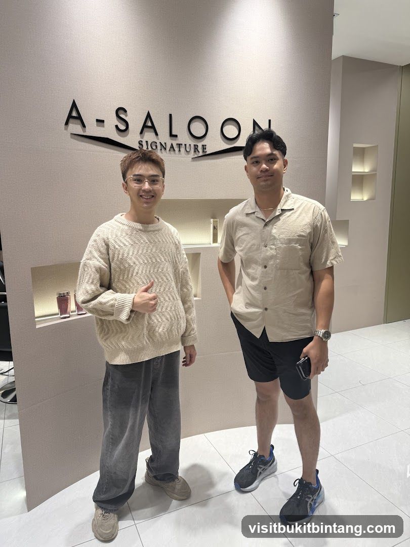 Two men in front of a salon sign