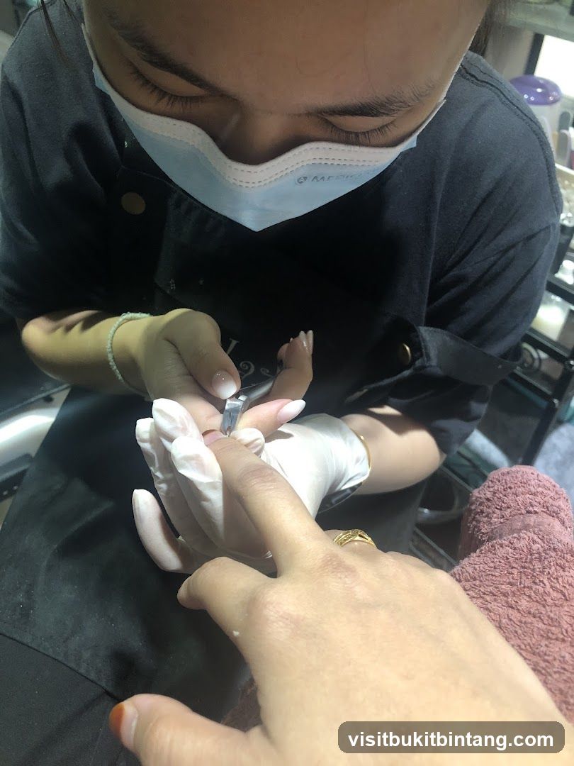 Nail Technician Working on Client's Nails
