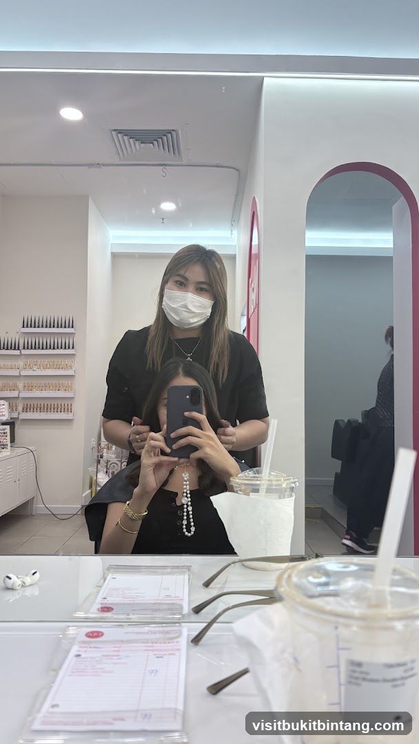 Hairdresser and client in salon