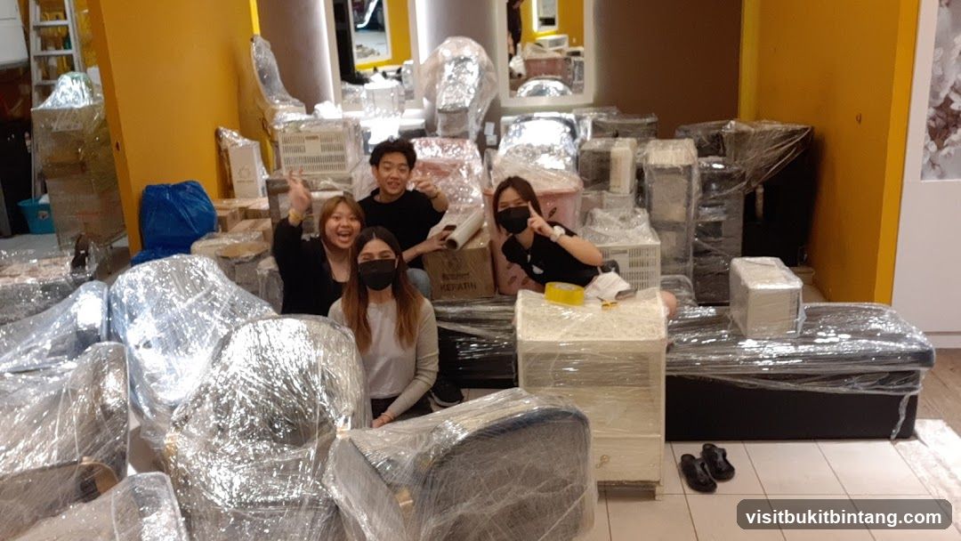 People Posing with Wrapped Furniture