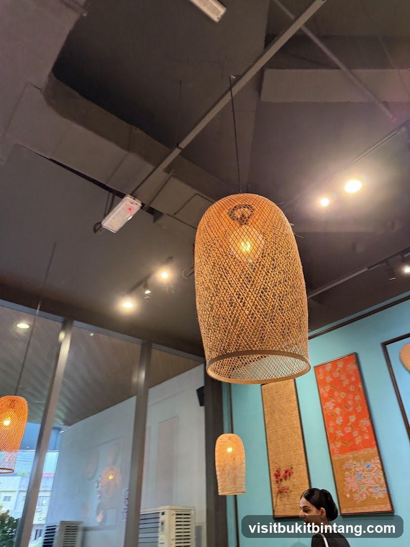 Interior of a restaurant with woven lamps and artwork