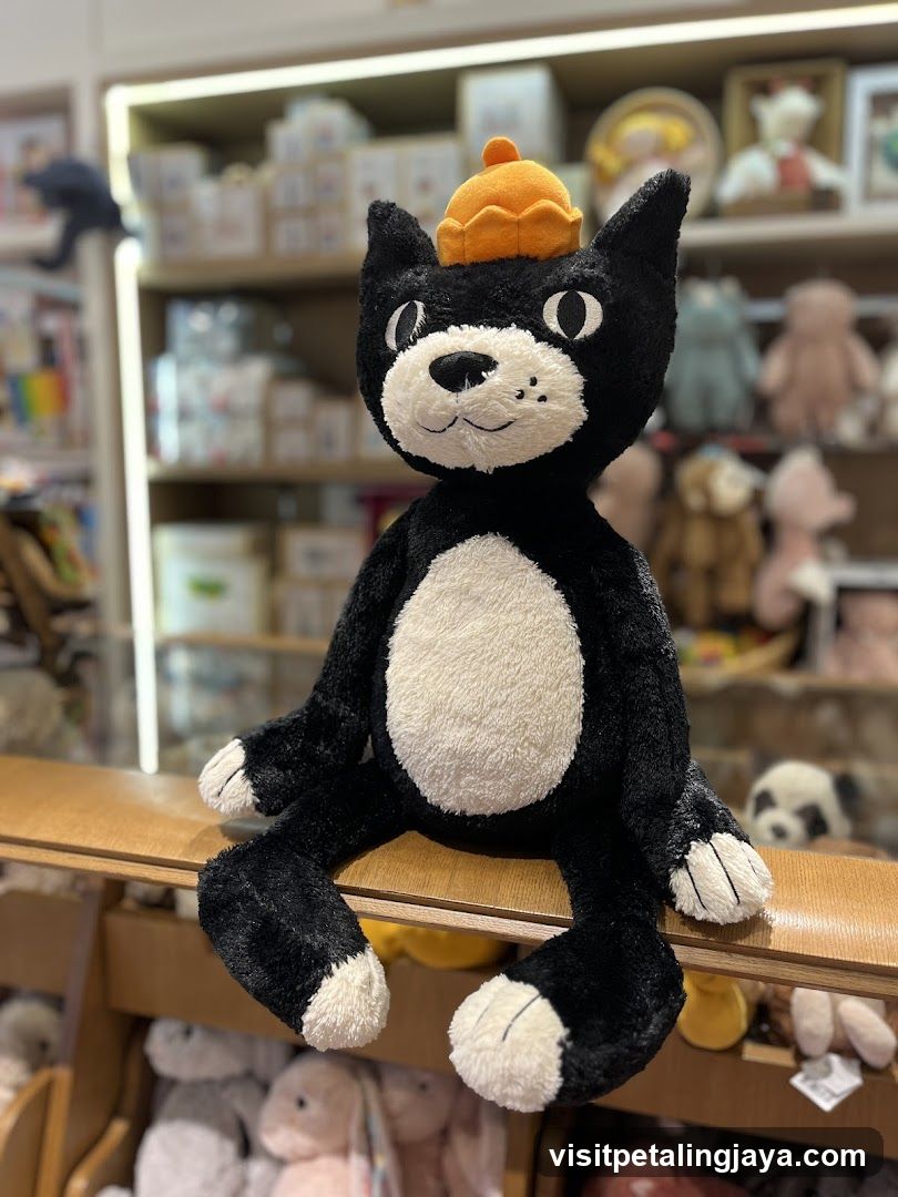 Black and White Cat Plush Toy with Orange Hat