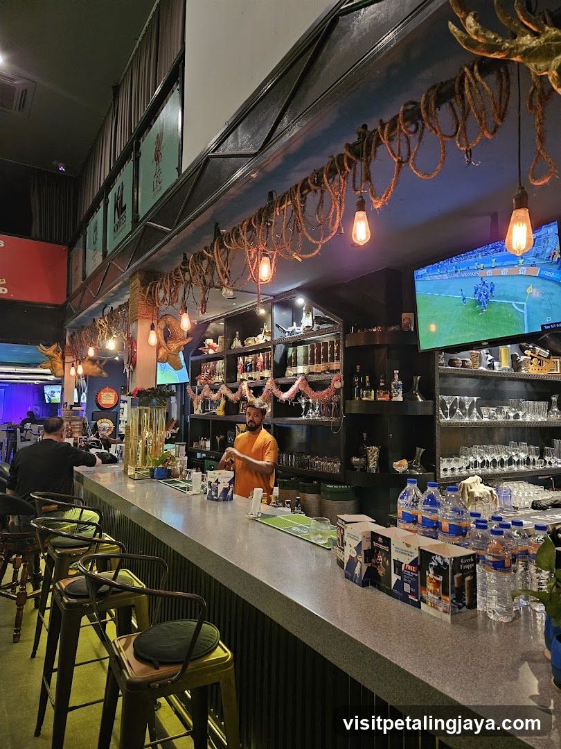 Bar Interior with Barista and TV Screen