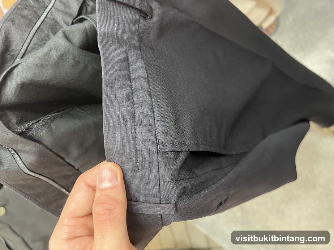 Close-up of black trousers