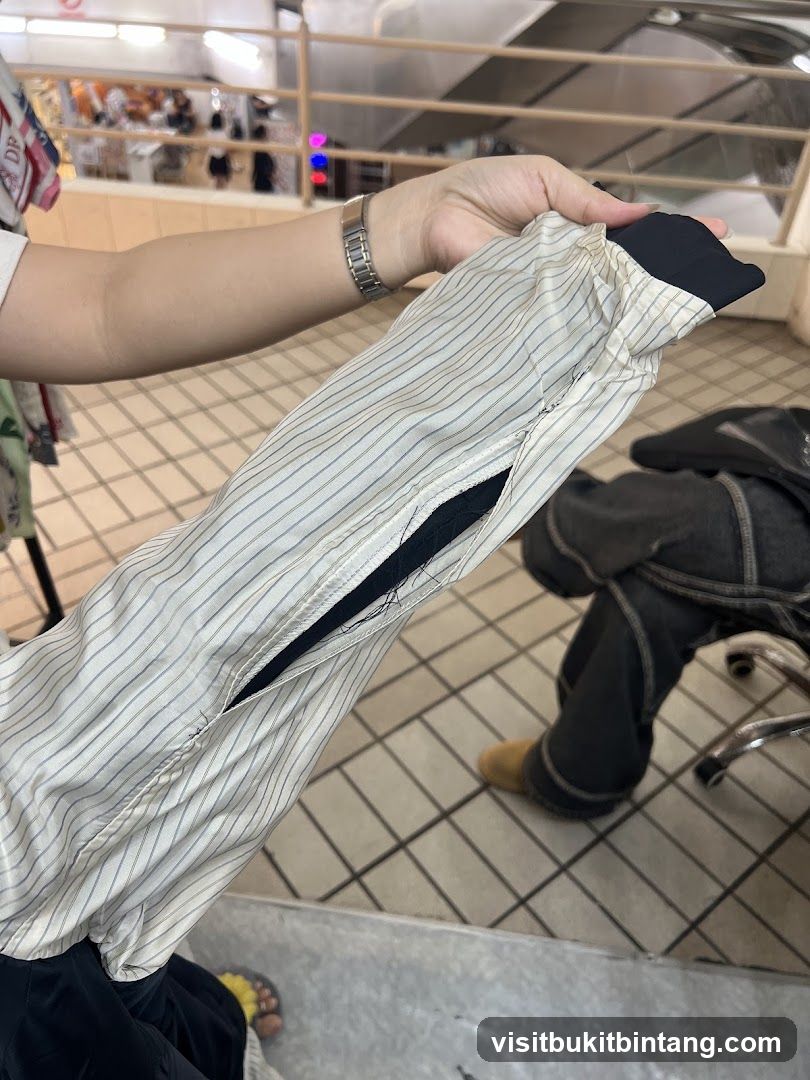 Person holding a striped garment