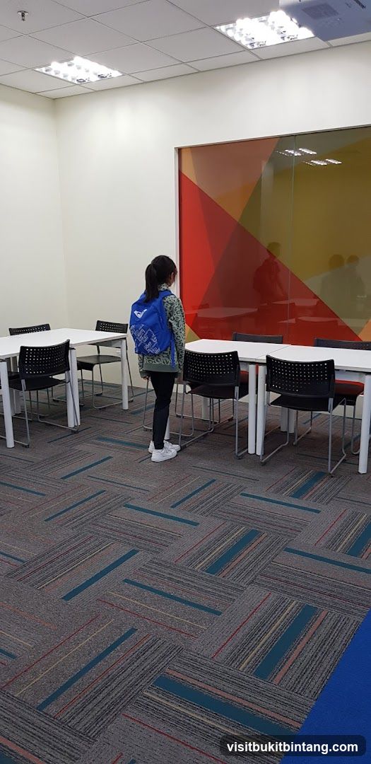 Student with backpack in a classroom