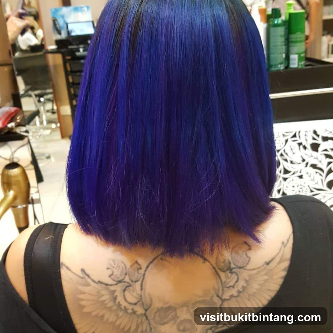 Woman with Blue Hair and Skull Tattoo