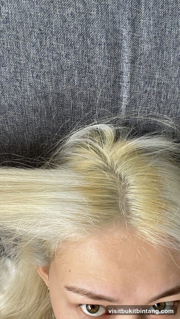 Close-up of a person's hair and eyes