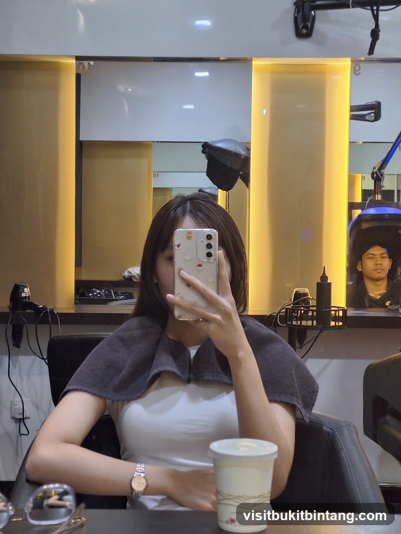 Woman taking a selfie in a salon