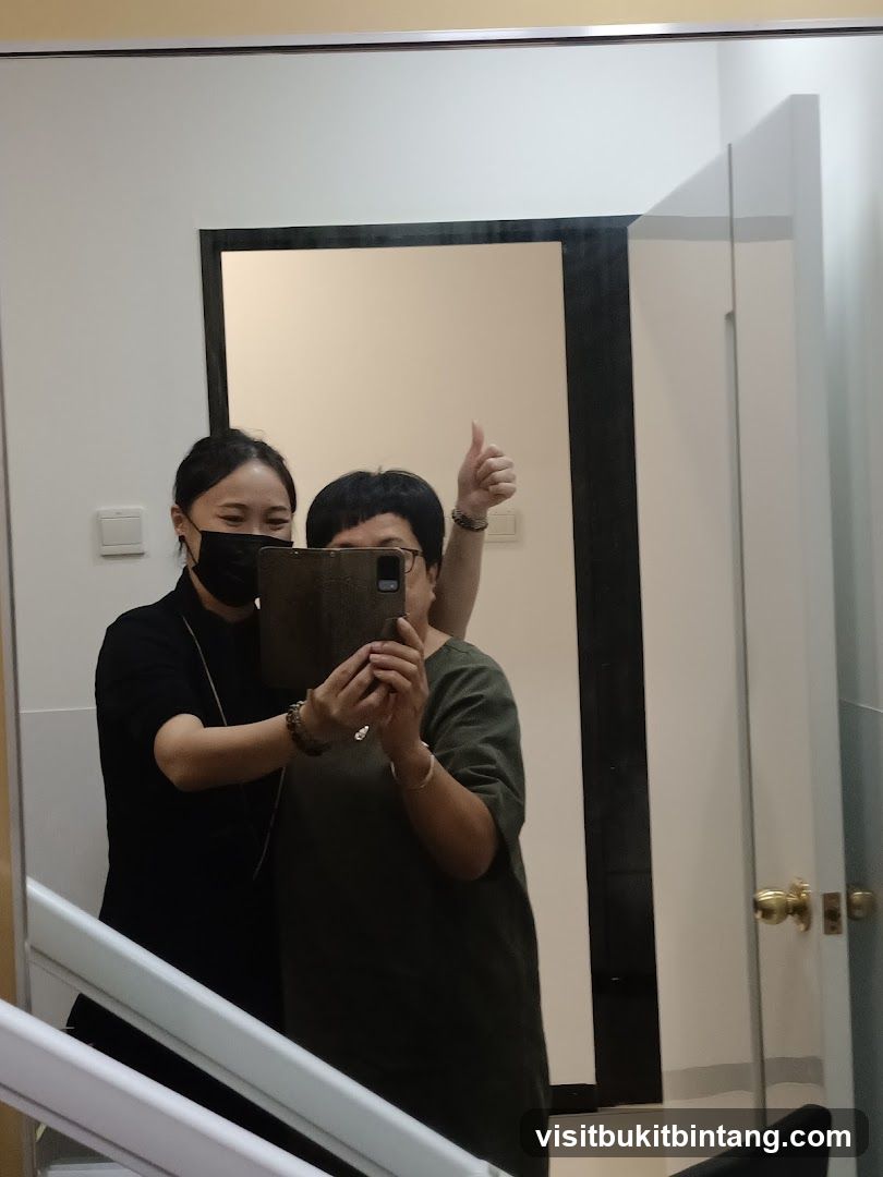 Two people taking a mirror selfie