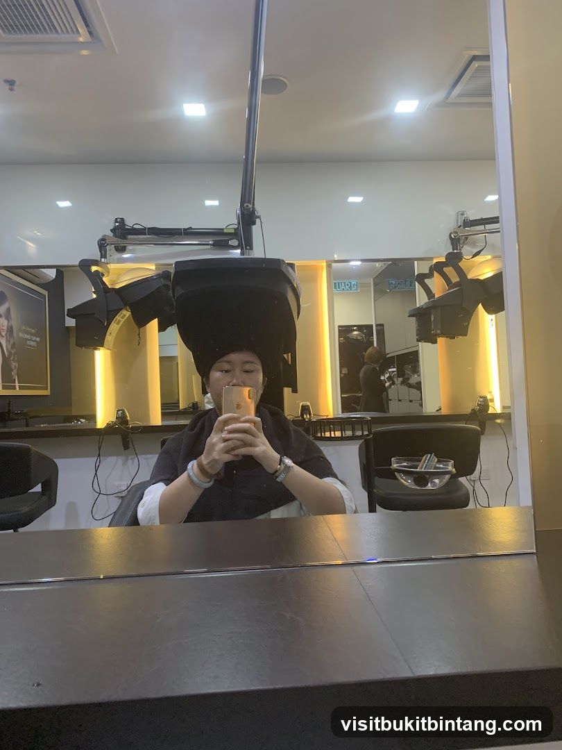 Woman under hair dryer