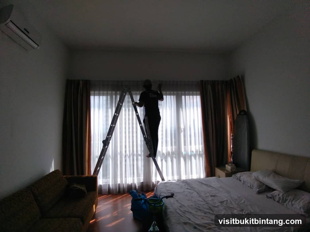 Man on Ladder by Window