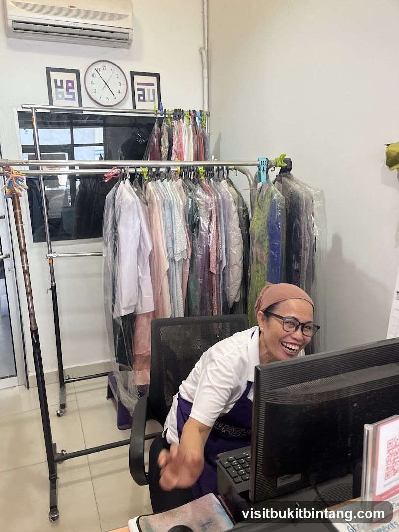 Dry Cleaner Employee at Desk