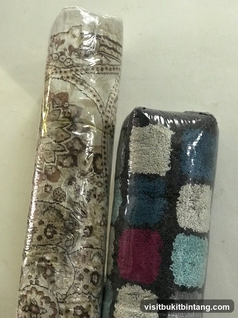 Two rolled rugs